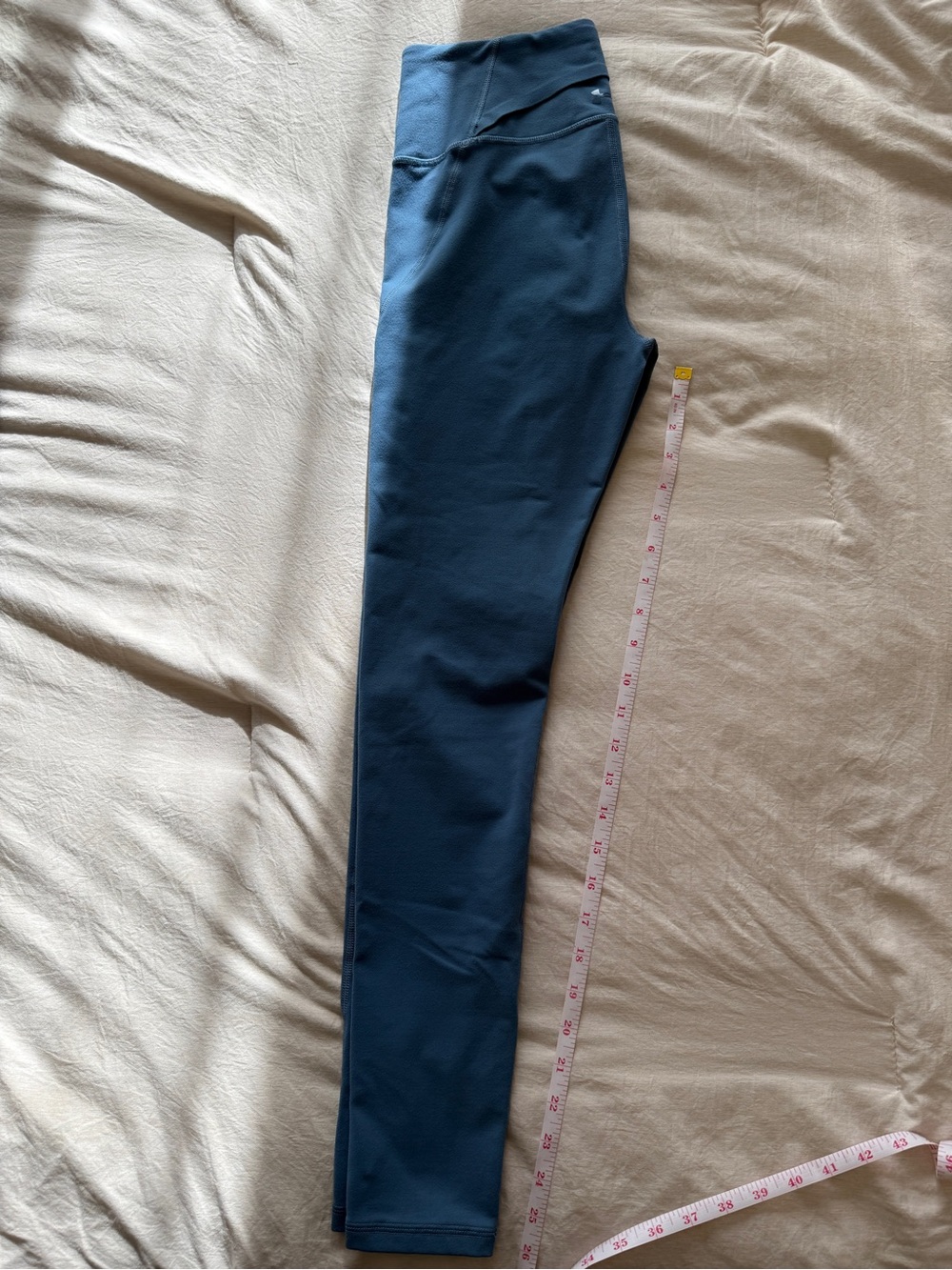 Under Armour blue leggings running training with back pocket size M 25”
